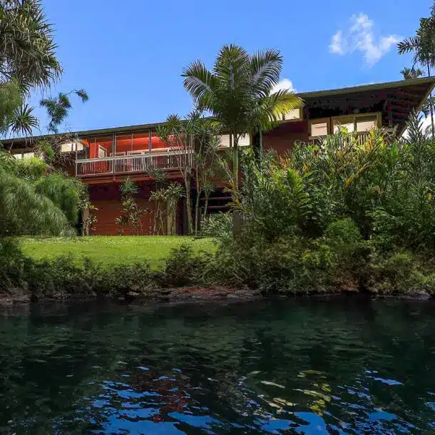 Luxurious Kauai vacation rental at The Riverhouse with riverfront views, Tommy Bahama furnishings, and modern amenities
