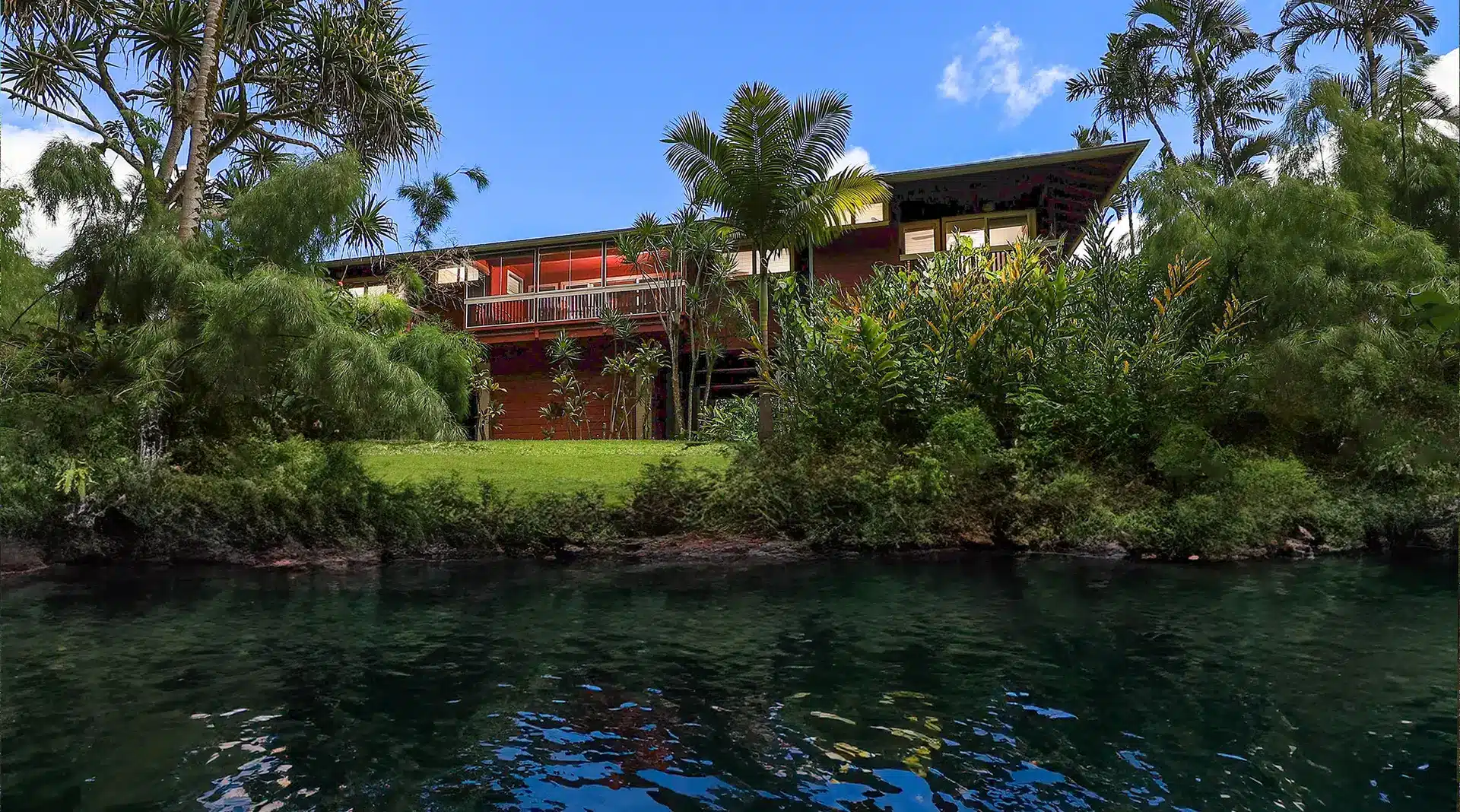 Luxurious Kauai vacation rental at The River House with riverfront views, Tommy Bahama furnishings, and modern amenities