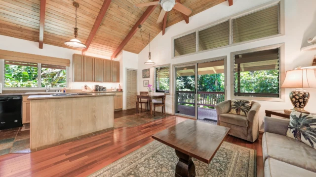 Step inside The Guest House at River Estate, Kauai, and enjoy the open layout connecting the kitchen and living area with elegant furnishings. Inviting Open Layout with Elegant Furnishings